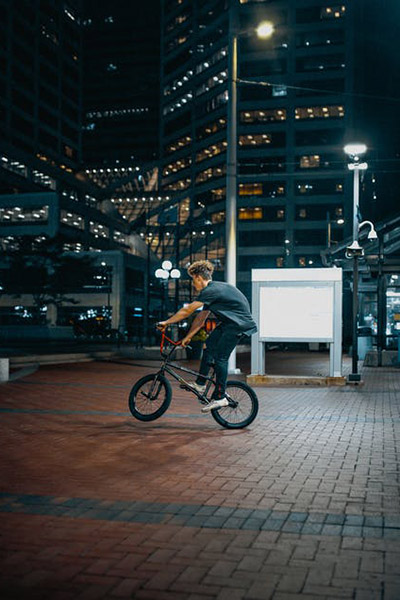 photo of a person riding a bike in the city